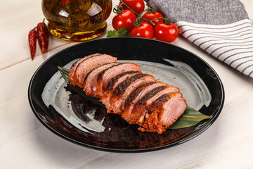 Sliced duck breast baked with cherry
