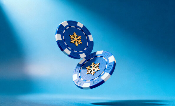 Holiday poker night? Two vibrant casino chips with gold snowflakes floating on blue background, perfect for gaming promos or winter events