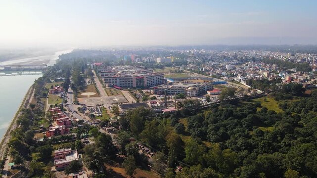 Lockdown in India due to Coronavirus- Aerial shot of AIMS Rishikesh, Uttarakhand, India during lockdown because of Coronavirus pandemic. Indian houses, Empty roads, no traffic. 4k.