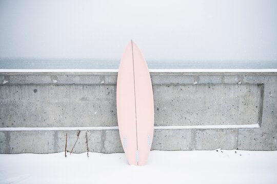 Surfboard in the winter snow