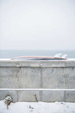 Surfboard in the winter snow