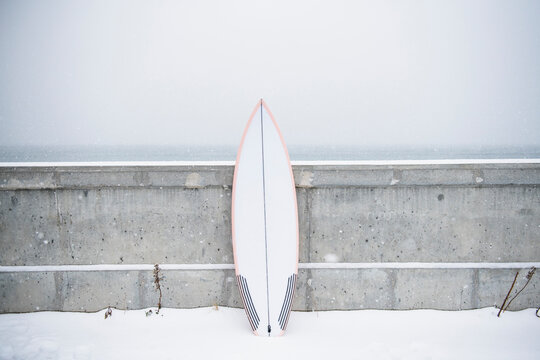 Surfboard in the winter snow