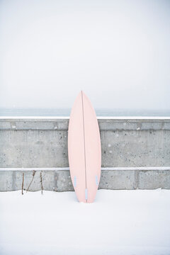 Surfboard in the winter snow
