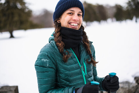 Woman happily cross country skiing in winter