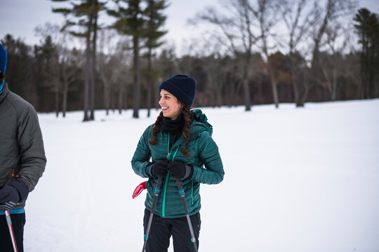 Woman happily cross country skiing in winter
