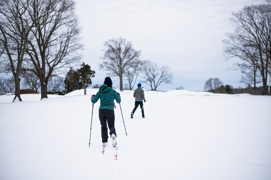 Couple cross country skiing in winter