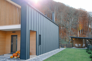 Modern autumn cabin enjoying nature getaway in forest
