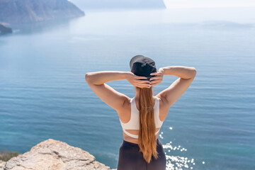 Hiker woman cliff edge enjoying breathtaking ocean view travel inspiration