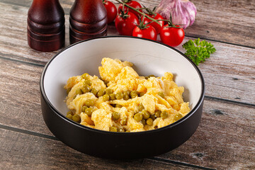 Scrambled egg omelet with green peas