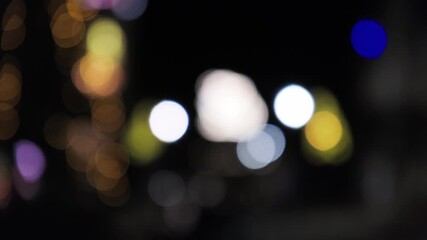 festive party lighting with multicolored bokeh lights forming tree silhouette and animated shimmer - Powered by Adobe