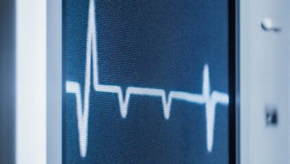 Close-up of a medical monitor displaying a heart rhythm waveform.