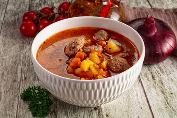 Tomato soup with meatballs and vegetables