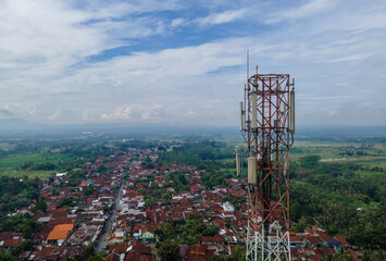 Aerial drone view of telecommunication tower in rural area. Technology Infrastructure from Above
