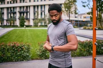 Ordinary Man Pursuing Weight Loss Through Outdoor Workout And Self-Tracking On Watch