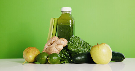 Ingredients, smoothie and bottle in studio for detox, vitamin drink and wellness benefits....
