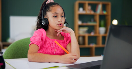 Online class, laptop and child with headset, home and listening to virtual tutoring session for exam. Studying, student and kid with mic for communication, education and fine motor skills for girl