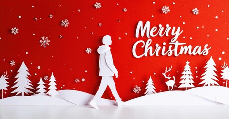 Papercraft scene depicts winter landscape. Person walks toward festive message, snowflakes fall. Red background creates holiday mood.