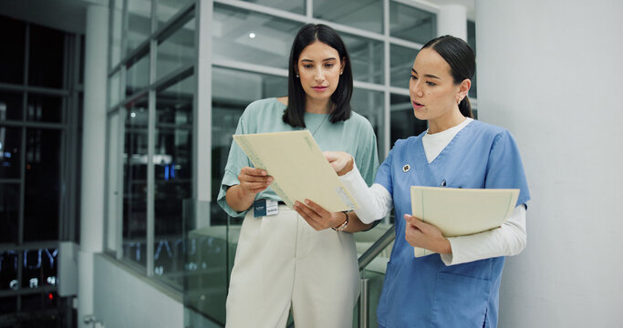 Team, documents and nurse or women in hospital for ward clerk, icu emergency and medical records at night. Healthcare administration, surgery schedule and discussion with people for overtime - Powered by Adobe
