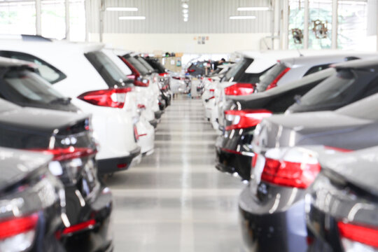 Abstract Blurry line of cars in the parking of shopping mall. Right copy space for text	