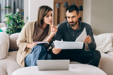 Couple managing home finances and planning budget
