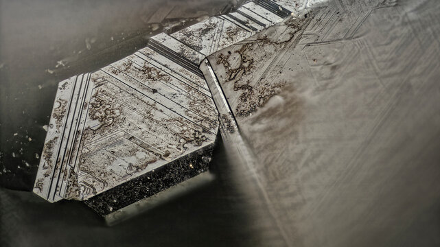 Sphalerite crystal from Dalnegorsk, Russia &mdash; opaque, metallic luster with tetrahedral form and striations under magnification &mdash; professional macro, micro mineral photography