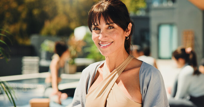 Exercise, mature and yoga instructor outdoor for teaching class, demonstration or lesson to students. Smile, wellness or zen and happy fitness coach in session with people for balance or inner peace