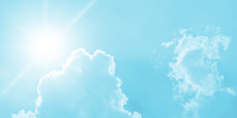 vivid, high-key abstract depiction of the sun in bright sky rendered in strong saturated cyan or aqua blue color. Central intense star-burst sun flare with bright white rays dominates