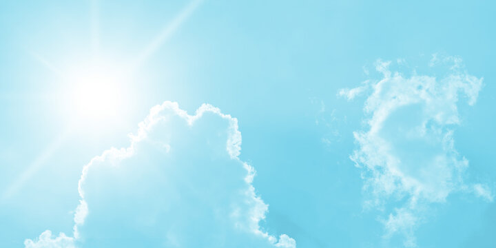 vivid, high-key abstract depiction of the sun in bright sky rendered in strong saturated cyan or aqua blue color. Central intense star-burst sun flare with bright white rays dominates