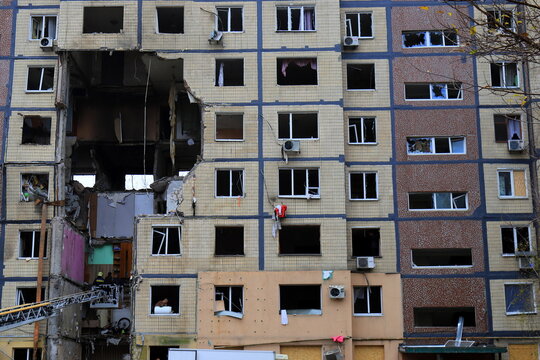 A Russian missile strike destroyed a house in Dnipro, Ukraine. A large hole in the residential building after a drone strike and fire. Russia's war against Ukraine