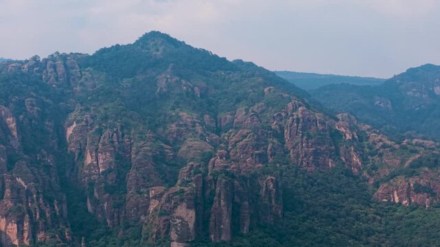 Drone shot featuring Tepozteco Hill rising above Tepoztlan, Morelos