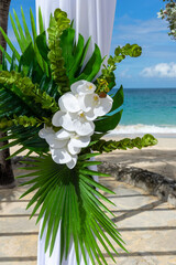 A destination wedding framed by sea, sky and flowers. Where paradise meets eternal love