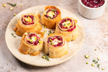 Delightful cranberry feta phyllo bites served on a decorative plate for a tasty appetizer