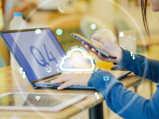 Close up businesswoman using phone with laptop remote work cloud system data future technology workplace cafe. Female leadership use browsing internet goal planning by AI chatbot. Network strategy