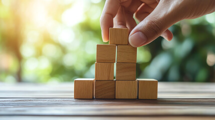 Hand positioning  Future Plan  block in wooden puzzle, strategic thinking and leadership concept