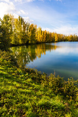 Banks and lawns around Lake Sabatouse in autumn in Longages