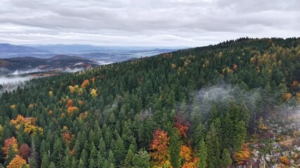Geologist surveys misty rocky landscape, Cinematic aerial footage of mountain ridge during fall with geological - Powered by Adobe