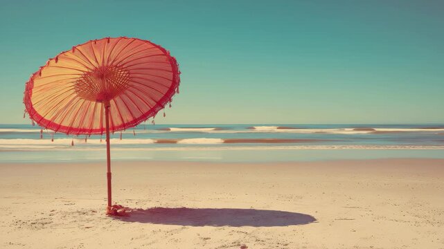 Retro style parasol on a sandy beach serenity under a bright sky with gentle waves in the background