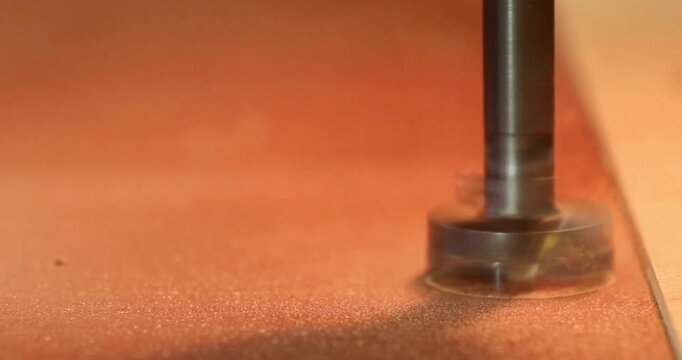 close-up carpenter workpiece in his workshop man worker board timber hand tool male smoothing the edge of wooden planks.
