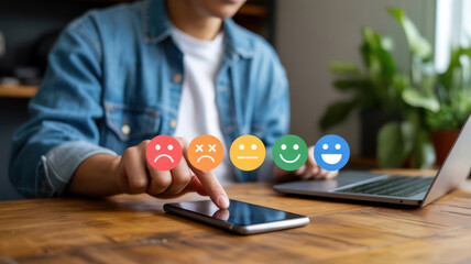 Customer satisfaction survey with smiley faces on a smartphone screen, representing feedback and user experience