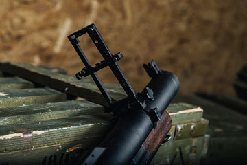 weapon parts on field station, military firearm assembly displayed during field maintenance