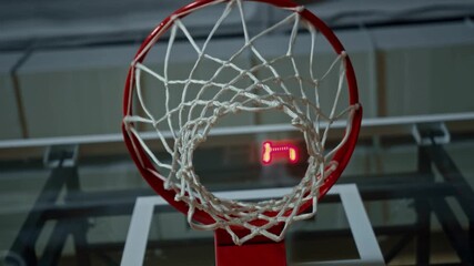 basketball ball hitting the basket. indoor basketball hoop in gym at school. - Powered by Adobe