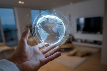 A human hand interacting with a glowing 3D holographic globe projected into a modern living room, symbolizing global connectivity.