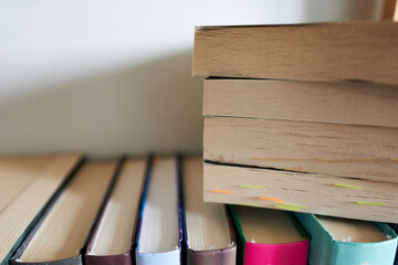Stack of books on a wooden table. Back to school. Copy space.