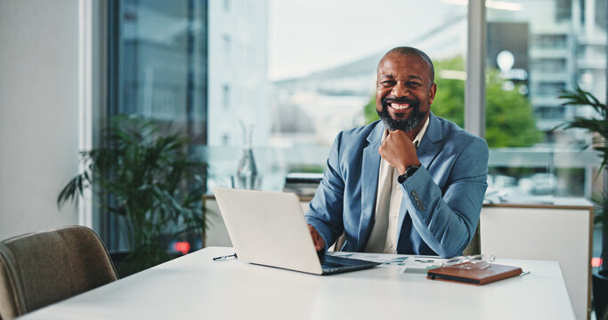 Laptop, black man or portrait with documents in business for sales trends, data analysis or reporting. Analytics manager, mature person and happy with graphs in office for KPI performance or planning - Powered by Adobe