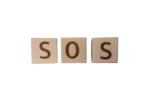 Wooden blocks spelling SOS, emergency signal, minimalistic design, educational tool, safety awareness