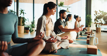 Fitness, yoga and people in lotus pose in studio for relax, peace and calm on wellness retreat....