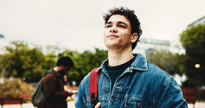 Outdoor, student and man on campus, thinking and education for skill development, learn or knowledge. Future, reflection and person with scholarship for opportunity, vision and studies at university