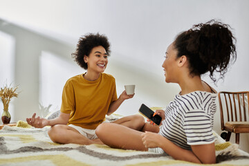 Happy lesbian couple enjoys quality time together in their modern apartment