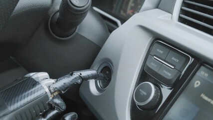Closeup inside electric vehicles robot hand pressing button ignition, car modern automobile concept - Powered by Adobe