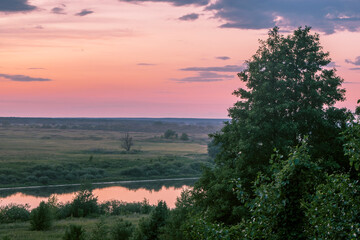 calm river mirror showcasing gentle pink and lavender hues with reed details for relaxation